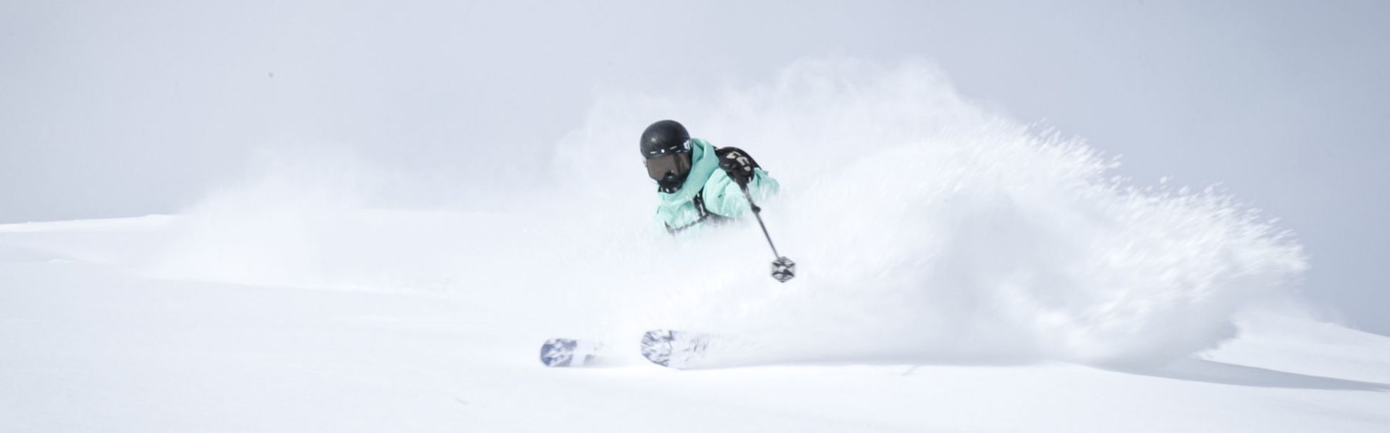 Teenager skiing through powder