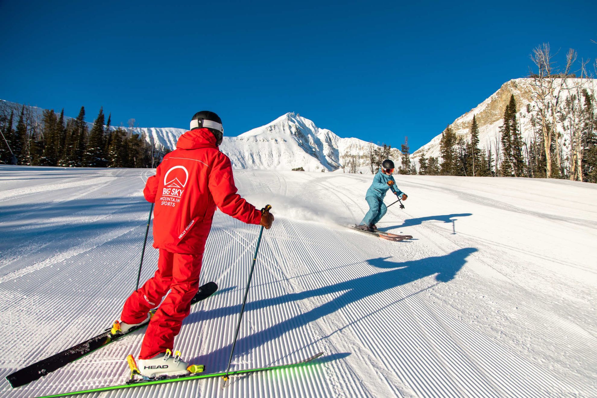 Instructor and Student Skiing